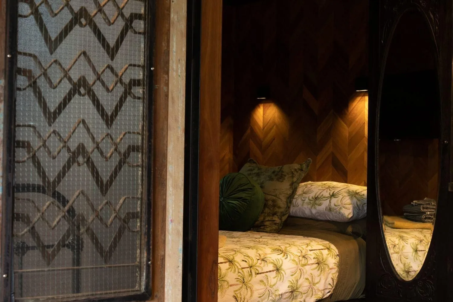 a bedroom glimpsed through the door