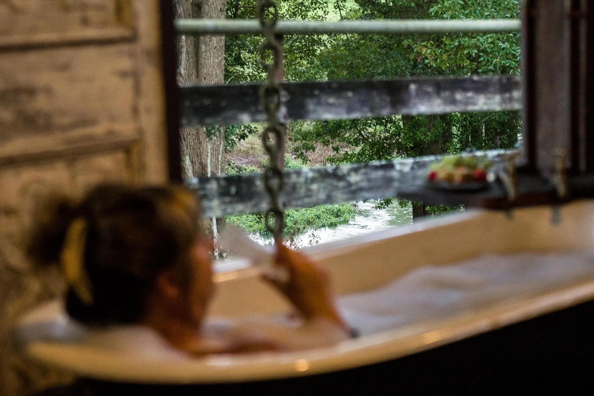 soaking in the barnita bath, creek out the window